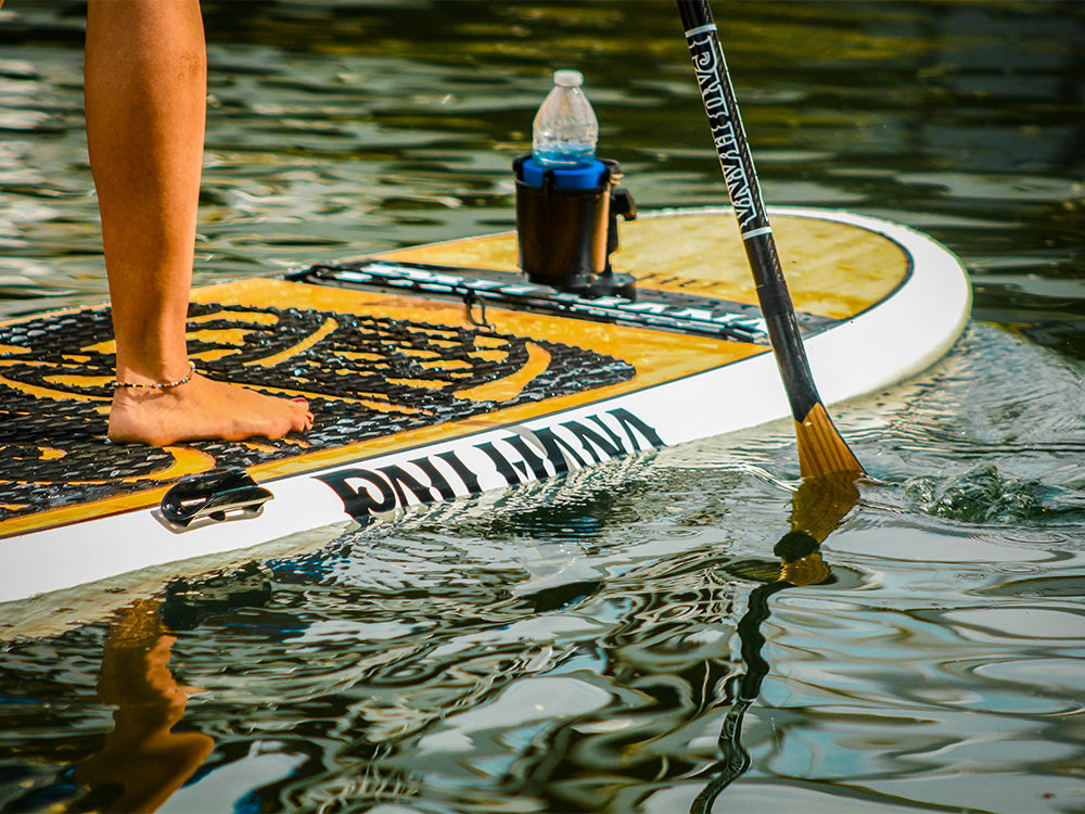 The Pau Hana Cup holder accessory on the front of the Oahu paddleboard using the Seamount system