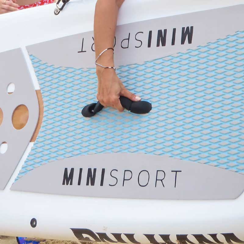 Pau Hana Surf Supply 10'10" Mini Sport high performance lightweight fiberglass paddleboard using the neoprene handle to carry