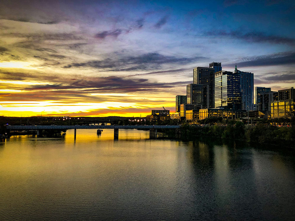 Ladybird lake in austin texas is a great place for paddleboarding at dusk