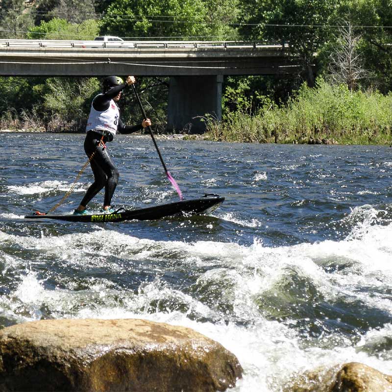 "Pau Hana Surf Supply Diablo whitewater SUP running whitewater rapids during the Kern River Festival slalom sup race"