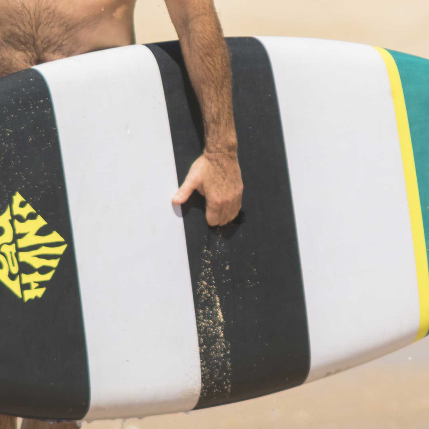 Ergonomic handle insert on a Pau Hana Surf Supply Grom X foam paddleboard