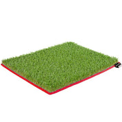 Artificial grass mat with red border on a white background