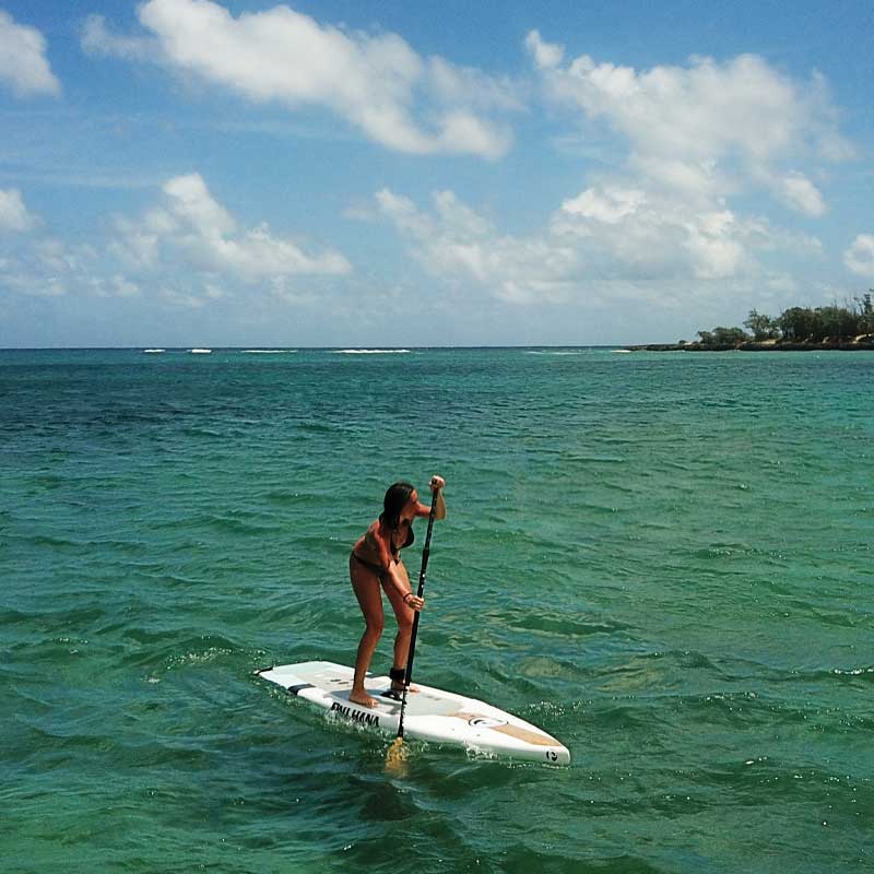 "Pau Hana Surf Supply lightweight Mini Sport fitness SUP showcasing speed and stability in choppy waters in Hawaii"