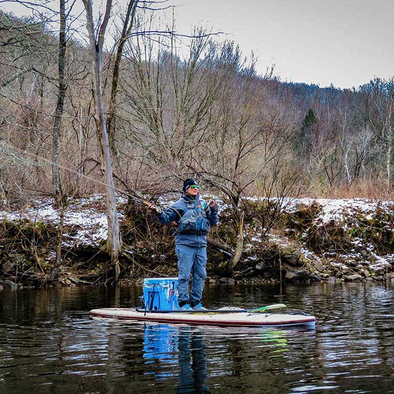 "Pau Hana Surf Supply 11'0" Navio VFT paddler false casting a  fly rod in early spring on Vermont reservoir"