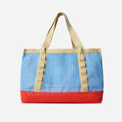 Tote bag with blue top half and red bottom half on a white background