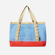 Tote bag with blue top half and red bottom half on a white background