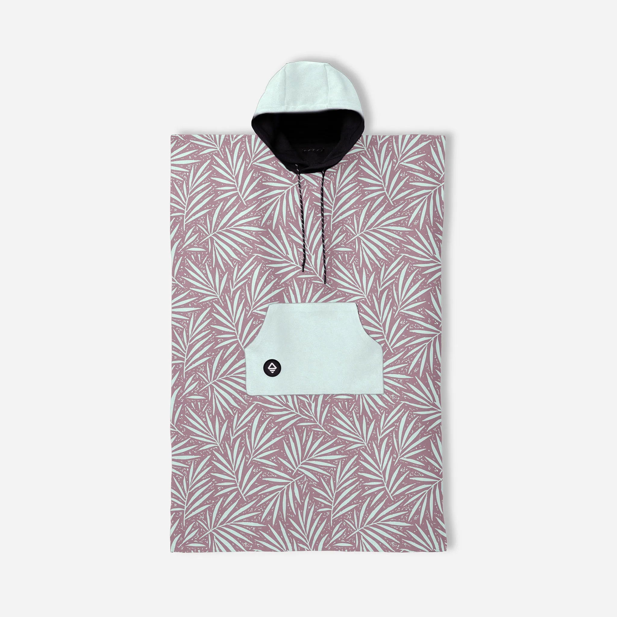 A hooded poncho-style towel or wrap with an allover tropical palm leaf pattern in dusty pink and white, featuring a light mint green front pocket with a black button and a black hood lining.