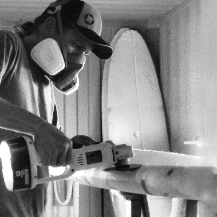 Shaping a Pau Hana Surf Supply paddleboard in California warehouse