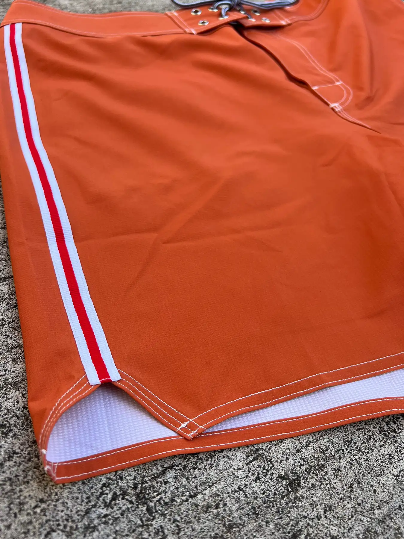close up image of a pair of red board shorts